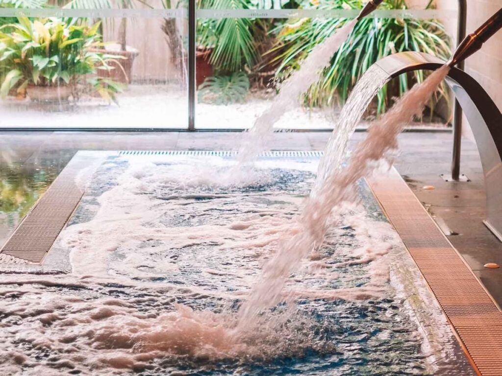 Relaxing indoor pool at Aimia Hotel’s wellness spa.