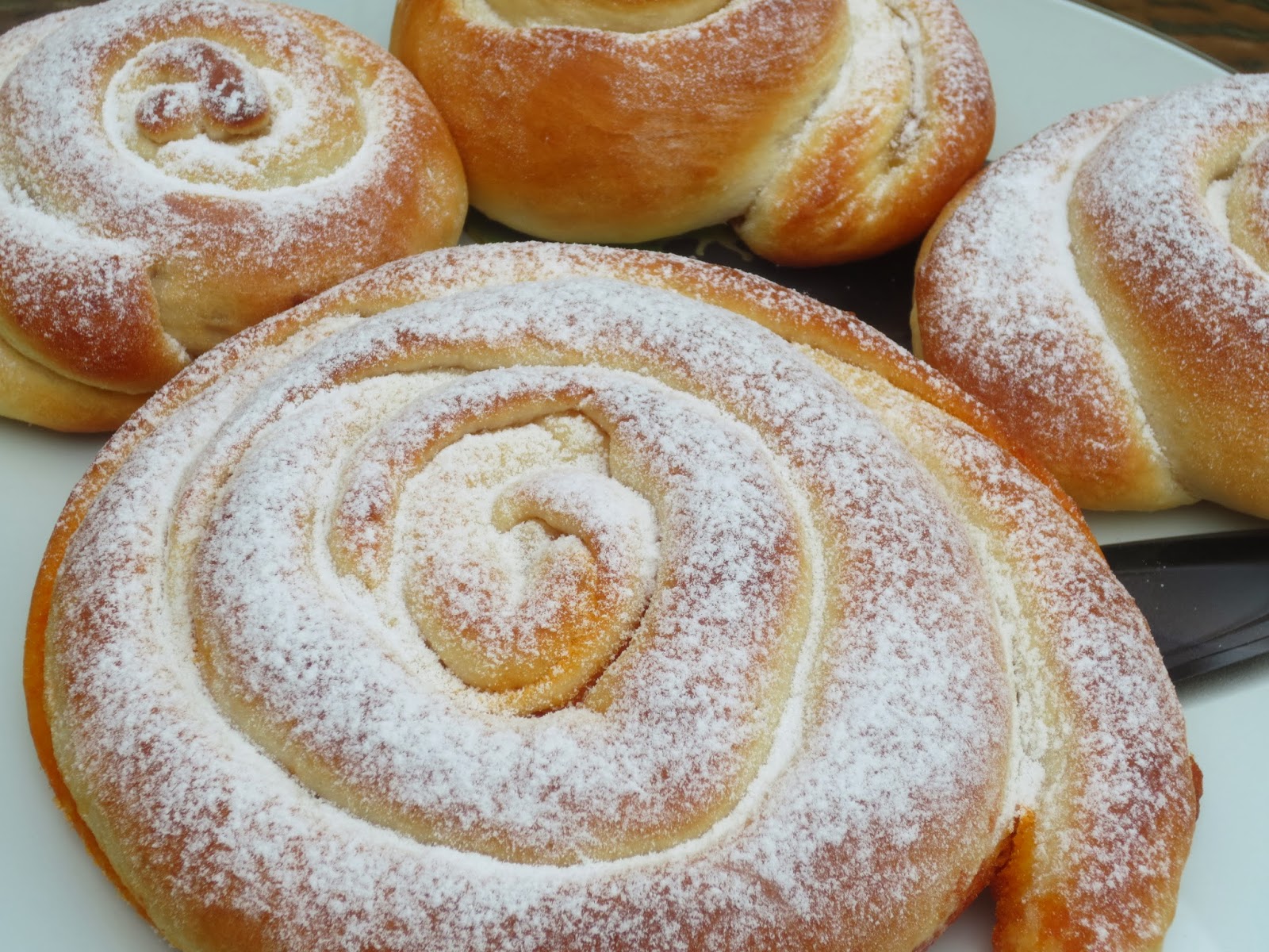 Traditional Mallorcan ensaimada dusted with powdered sugar.