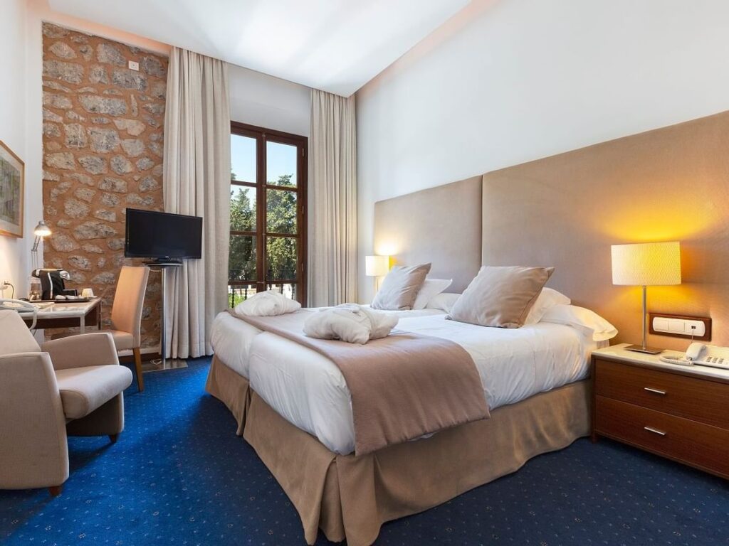 Bright and comfortable bedroom at the Gran Hotel Sóller.