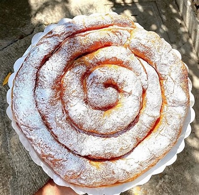 Freshly baked ensaimadas in a local Mallorca bakery.