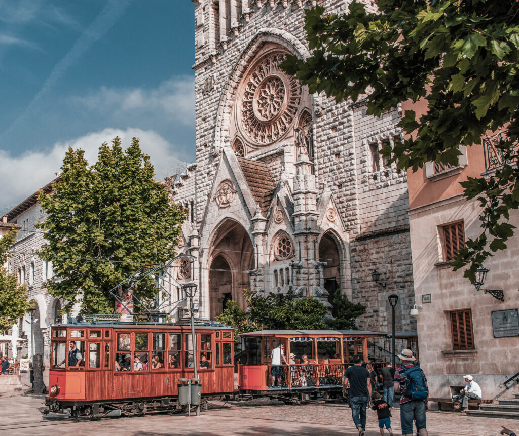 A view of Sóller and its cathedral, surrounded by charming streets and nestled in the scenic Mallorca landscape.