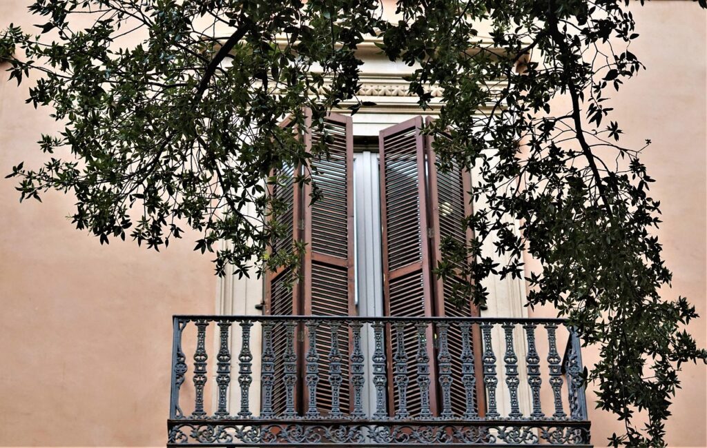 Colorful building in Santa Catalina, Mallorca, featuring traditional Mallorcan shutters and charming architecture.