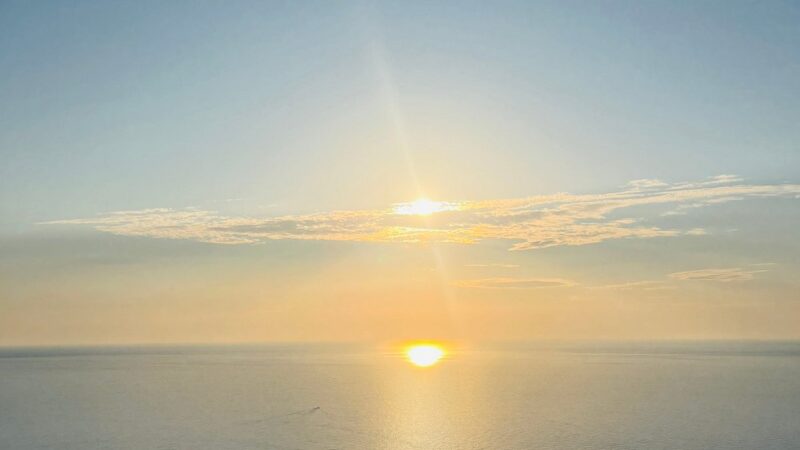 Watching the sun dip below the horizon at Sa Foradada viewpoint.