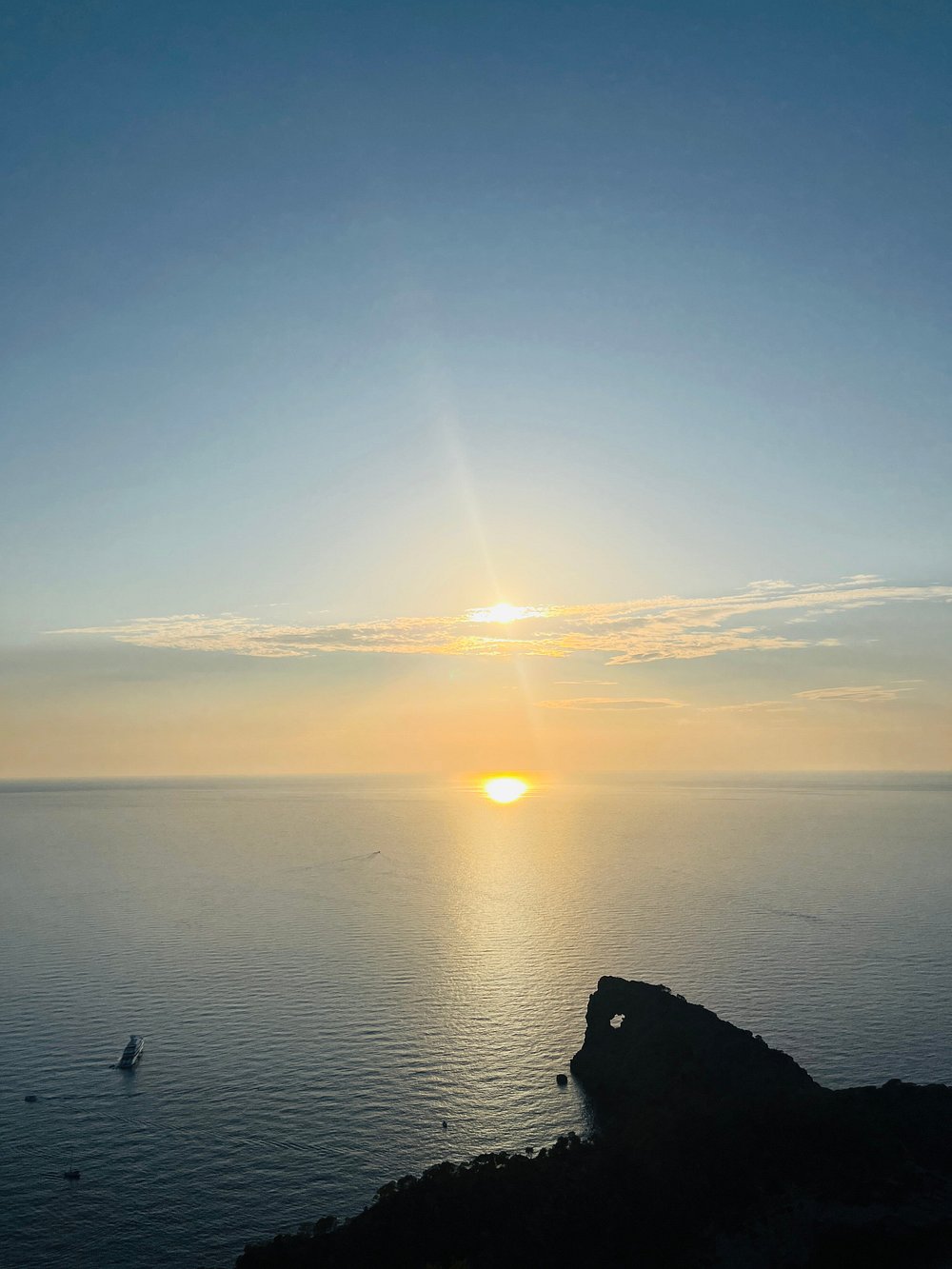 Watching the sun dip below the horizon at Sa Foradada viewpoint.